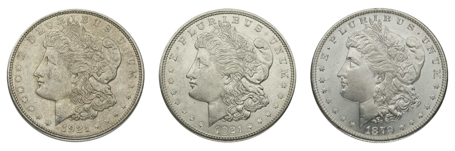 Three Morgan dollars showing heavy wear, light wear, and no wear